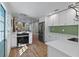 Bright, open kitchen with modern appliances and a view into the stylish dining area at 4944 28Th S Ave, Gulfport, FL 33707