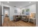 Bright living room featuring neutral walls, wood flooring, and two upholstered armchairs at 4944 28Th S Ave, Gulfport, FL 33707