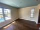 Bright bedroom with hardwood flooring and serene views of the pool at 514 Cedar Woods Dr, Oldsmar, FL 34677