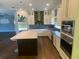 Elegant kitchen featuring modern appliances and a stylish island at 514 Cedar Woods Dr, Oldsmar, FL 34677