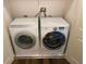 Functional laundry closet featuring a side-by-side washer and dryer at 514 Cedar Woods Dr, Oldsmar, FL 34677