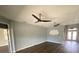 Spacious living room with modern ceiling fans and hardwood flooring at 514 Cedar Woods Dr, Oldsmar, FL 34677