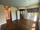 Spacious main bedroom featuring hardwood floors, an attached screened porch, and ensuite bathroom at 514 Cedar Woods Dr, Oldsmar, FL 34677