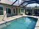 Screened-in pool with a clear blue hue, perfect for relaxation and enjoying outdoor living at 514 Cedar Woods Dr, Oldsmar, FL 34677