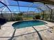 Inviting screened-in pool surrounded by a brick paver deck, perfect for outdoor entertaining at 514 Cedar Woods Dr, Oldsmar, FL 34677