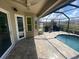 View of screened-in pool featuring outdoor patio area, and a ceiling fan at 514 Cedar Woods Dr, Oldsmar, FL 34677