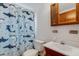 bathroom featuring a shark shower curtain and wood vanity at 80 Squire Ct, Dunedin, FL 34698