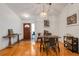 Dining room with hardwood floors, white walls, and modern light fixture at 80 Squire Ct, Dunedin, FL 34698