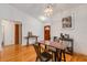 Dining room boasting hardwood floors and contemporary decor and a view of the front door at 80 Squire Ct, Dunedin, FL 34698