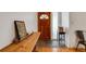 Entryway with hardwood floors, wooden door, and decorative table at 80 Squire Ct, Dunedin, FL 34698