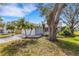 Charming home exterior with lush landscaping and well-maintained grounds at 80 Squire Ct, Dunedin, FL 34698