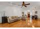 Spacious living room showcasing hardwood floors, vaulted ceiling and open floor plan at 80 Squire Ct, Dunedin, FL 34698
