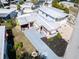 Aerial view of the home highlighting the roofline, landscaping, and surrounding neighborhood at 807 Saint Charles Dr, Tarpon Springs, FL 34689