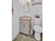 Bathroom with a sink, toilet, rug and tiled floors at 807 Saint Charles Dr, Tarpon Springs, FL 34689