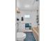 Bathroom with sink, toilet, shower and a window for natural light at 807 Saint Charles Dr, Tarpon Springs, FL 34689
