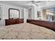 Bedroom with a door to the outside, bureau and closet at 807 Saint Charles Dr, Tarpon Springs, FL 34689