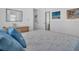 Bedroom with blue pillows, bureau, and mirror at 807 Saint Charles Dr, Tarpon Springs, FL 34689