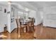 Cozy dining area featuring a wooden table, chairs, and natural light at 807 Saint Charles Dr, Tarpon Springs, FL 34689