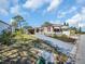 Charming single-Gathering home with a well-manicured yard and a long driveway at 807 Saint Charles Dr, Tarpon Springs, FL 34689