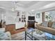 Inviting living room featuring ample seating, hardwood floors, and an open floor plan at 807 Saint Charles Dr, Tarpon Springs, FL 34689