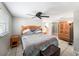 The main bedroom offers a ceiling fan, tiled floors, and natural light at 8415 Westridge Dr, Tampa, FL 33615