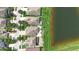 Aerial view of homes, showcasing backyards, landscaping, and a serene lake, highlighting the community's appeal at 924 Peregrine Hill Pl, Ruskin, FL 33570