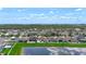 Panoramic aerial shot of neighborhood and lake, highlighting community layout, lush landscaping, and serene waterfront views at 924 Peregrine Hill Pl, Ruskin, FL 33570