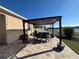 Paver patio under a pergola, great for outdoor dining with beautiful views at 924 Peregrine Hill Pl, Ruskin, FL 33570