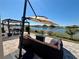 Outdoor seating area offering a stunning water view, ideal for relaxing or entertaining guests at 924 Peregrine Hill Pl, Ruskin, FL 33570
