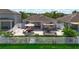 Aerial shot showcasing an outdoor patio with furniture, dining area, and a fenced-in yard with a shed at 924 Peregrine Hill Pl, Ruskin, FL 33570