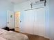 Bedroom with neutral walls, carpeted floor, and bi-fold closet at 924 Peregrine Hill Pl, Ruskin, FL 33570