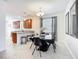 Cozy dining area with pendant lights, tile floor, and view of the kitchen at 924 Peregrine Hill Pl, Ruskin, FL 33570