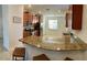 Open kitchen featuring granite countertops, stainless appliances, and ample cabinet space at 924 Peregrine Hill Pl, Ruskin, FL 33570