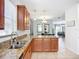Bright kitchen featuring granite countertops, stainless steel sink, and open floor plan at 924 Peregrine Hill Pl, Ruskin, FL 33570