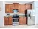 Well-equipped kitchen with stainless steel appliances and granite countertops at 924 Peregrine Hill Pl, Ruskin, FL 33570