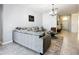 Inviting living room with a comfortable sofa, elegant decor, and an open layout, perfect for relaxation at 924 Peregrine Hill Pl, Ruskin, FL 33570