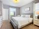 Serene bedroom featuring a plush bed, soft carpet, and soothing decor, creating a peaceful retreat at 924 Peregrine Hill Pl, Ruskin, FL 33570