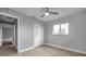 Comfortable bedroom with hardwood floors, a ceiling fan, and a spacious closet at 9915 39Th N St # 3, Pinellas Park, FL 33782