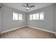 Bright bedroom with hardwood floors and large windows, offering plenty of natural light at 9915 39Th N St # 3, Pinellas Park, FL 33782