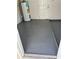 Tidy garage space, with a painted floor, and a view of the water heater at 9915 39Th N St # 3, Pinellas Park, FL 33782