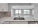 Beautiful kitchen countertop looking into the living area with lots of natural light at 9915 39Th N St # 3, Pinellas Park, FL 33782