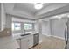 Open-concept kitchen featuring a quartz countertop and stainless steel appliances at 9915 39Th N St # 3, Pinellas Park, FL 33782