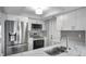 Modern kitchen featuring stainless steel appliances, white cabinets, and stylish countertops at 9915 39Th N St # 3, Pinellas Park, FL 33782