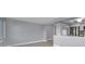 Open concept living room leading into the kitchen featuring stainless steel appliances at 9915 39Th N St # 3, Pinellas Park, FL 33782