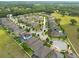 Community aerial showcasing tree-lined streets, backyard pools, and a well-maintained suburban setting at 10428 Arbor Groves Pl, Riverview, FL 33578