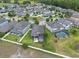 Aerial shot of a home with a screened-in porch, hot tub, and outdoor patio at 10428 Arbor Groves Pl, Riverview, FL 33578