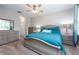 Inviting bedroom with plush carpeting, a ceiling fan, and neutral decor at 10428 Arbor Groves Pl, Riverview, FL 33578