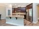 Kitchen with stainless steel appliances, granite counters, and dark wood cabinets at 10428 Arbor Groves Pl, Riverview, FL 33578