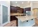 Well-lit kitchen with stainless steel appliances, granite counters, and ample cabinet space at 10428 Arbor Groves Pl, Riverview, FL 33578
