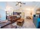 View of the open-concept living room and kitchen with stainless steel appliances at 10428 Arbor Groves Pl, Riverview, FL 33578